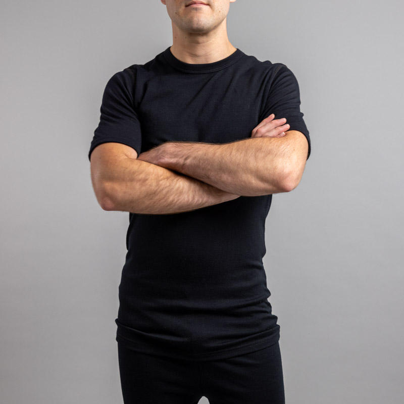 Male wearing SP121B Merino Skins – Unisex Short Sleeve Crew Neck – Black