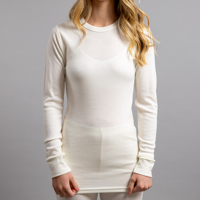 Female wearing White SP191 Merino Skins – Unisex Long Sleeve Crew Neck
