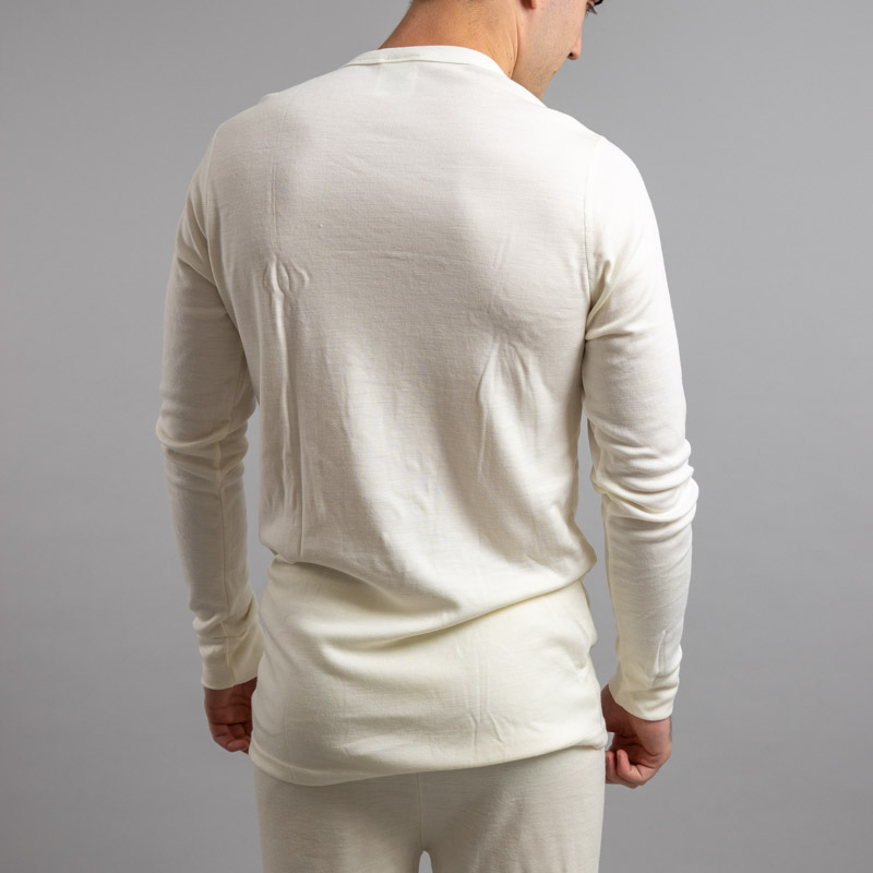 Male wearing White SP191 Merino Skins – Unisex Long Sleeve Crew Neck