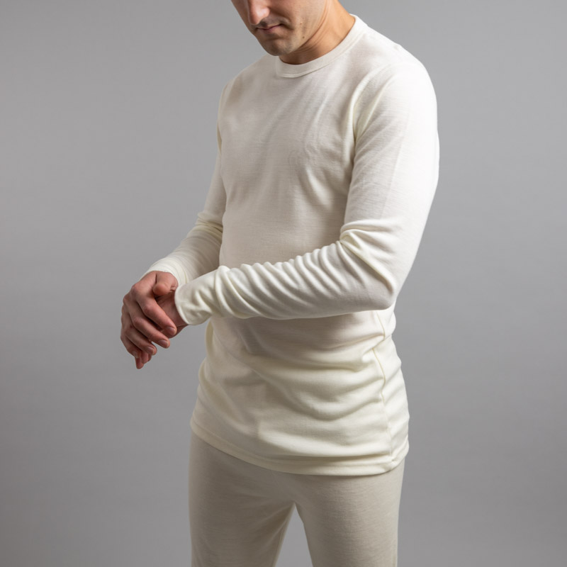 Male wearing White SP191 Merino Skins – Unisex Long Sleeve Crew Neck