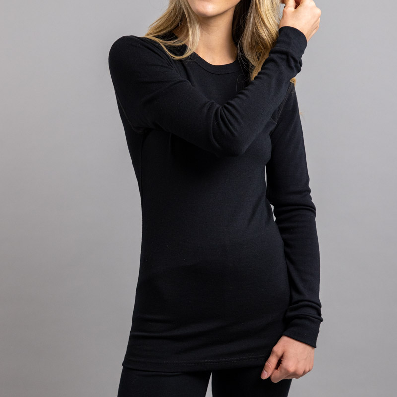 Female wearing Black SP191B Merino Skins – Unisex Long Sleeve Crew Neck