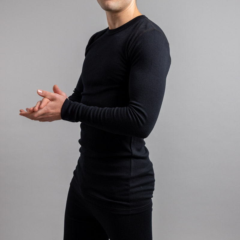 Male wearing Black SP191B Merino Skins – Unisex Long Sleeve Crew Neck