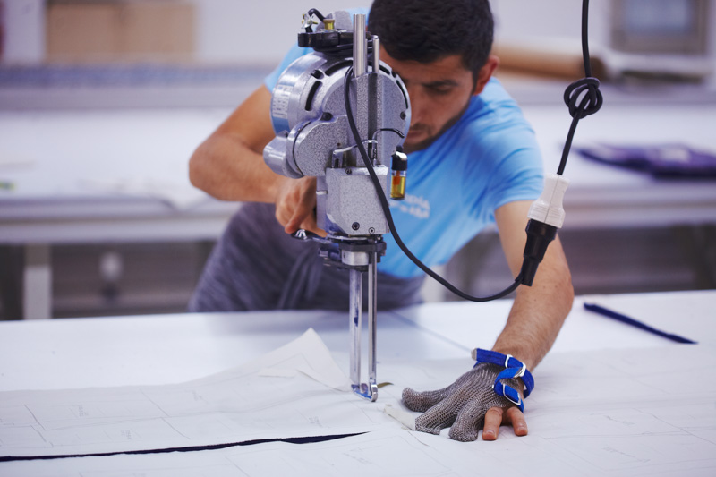 worker cutting fabric