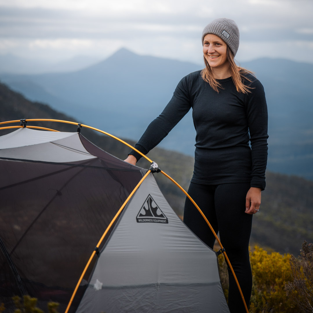 hiking lady wearing long sleeve merino t shirt and merino long johns