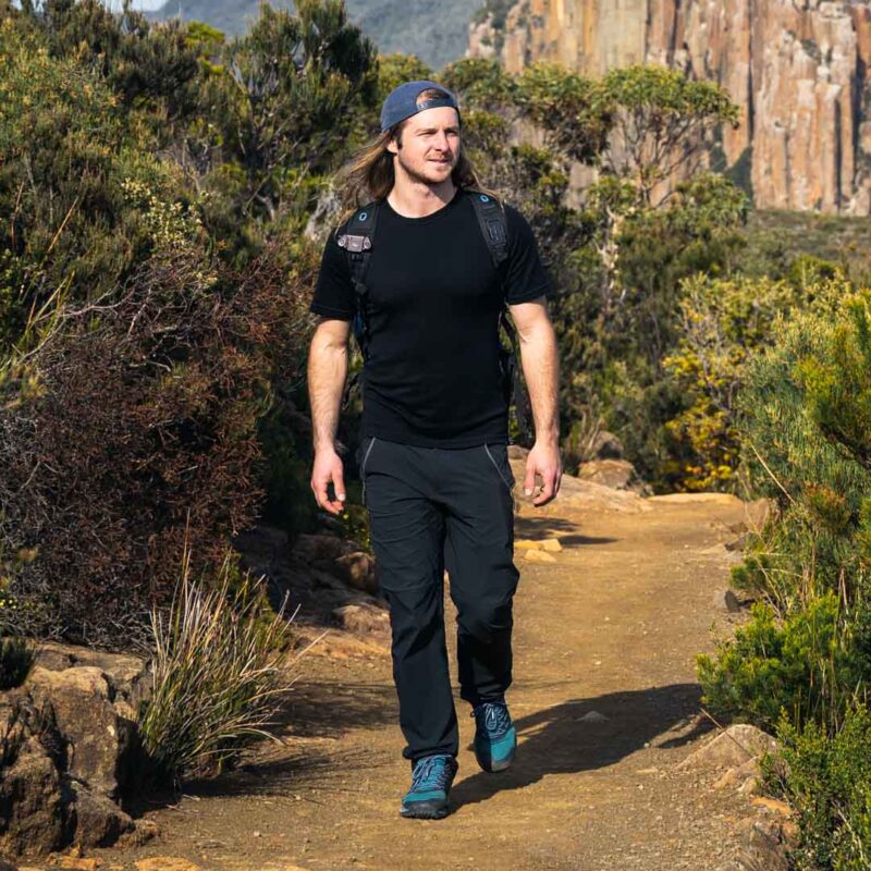 man hiking wearing short sleeve merino t shirt