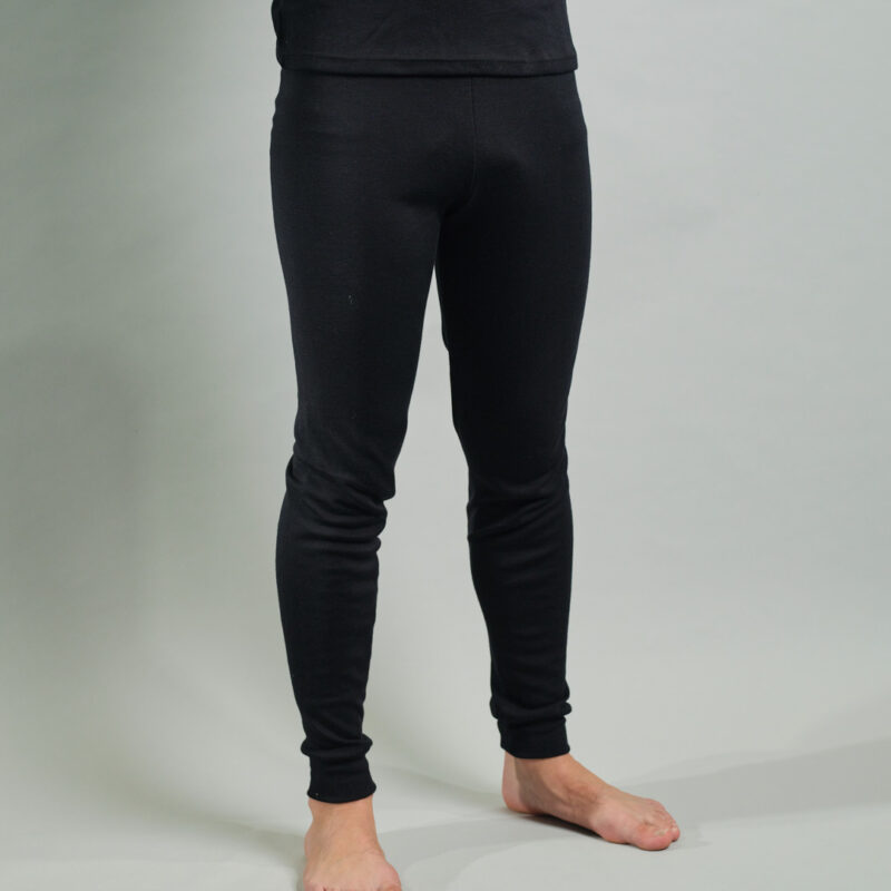 front view of a male wearing black Merino Skins unisex long johns